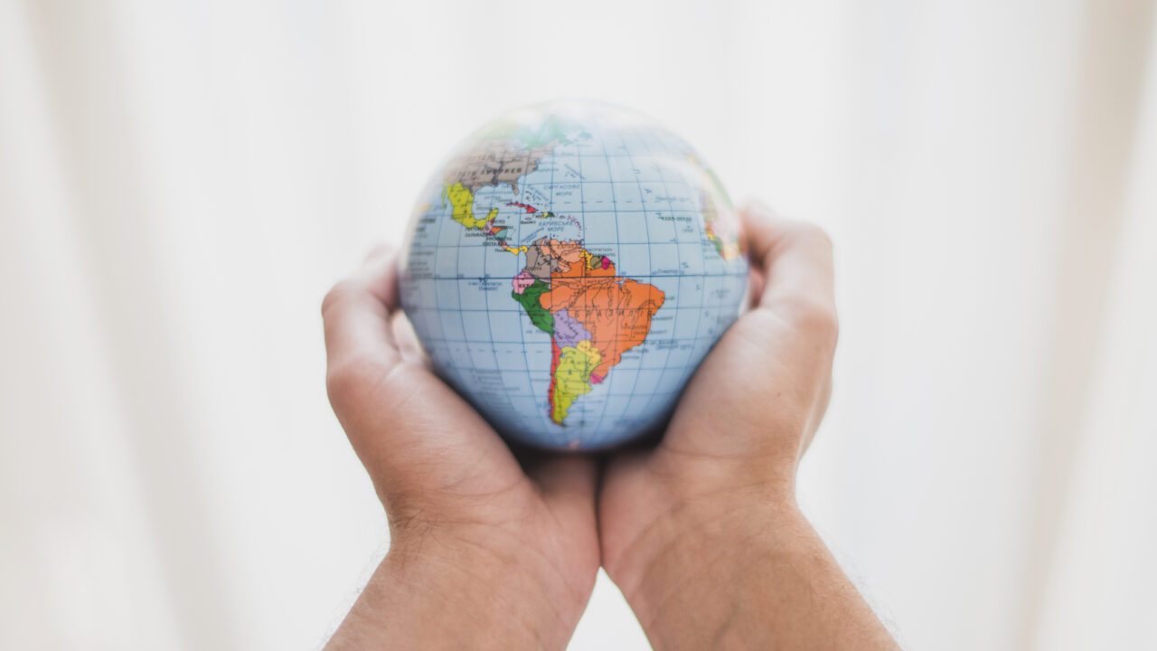 https://www.partidodelau.com/wp-content/uploads/2022/12/person-s-hand-holding-small-globe-1-1280x720.jpg