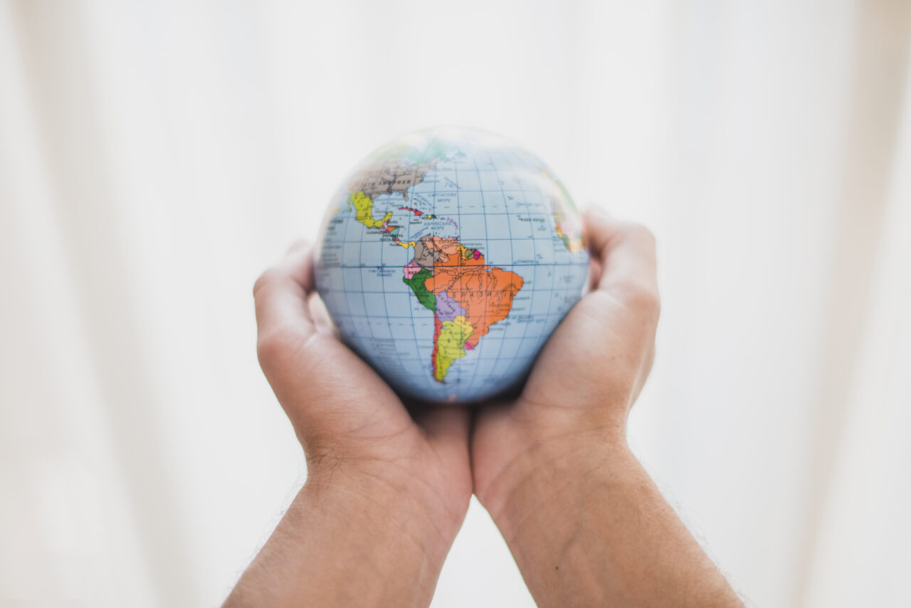 https://www.partidodelau.com/wp-content/uploads/2022/12/person-s-hand-holding-small-globe-1-1280x854.jpg